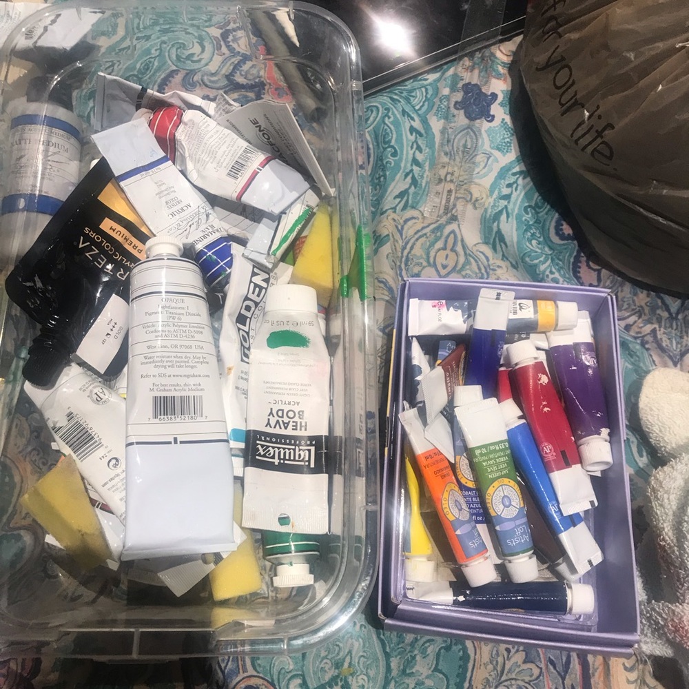 Acrylic and oil paint with brushes